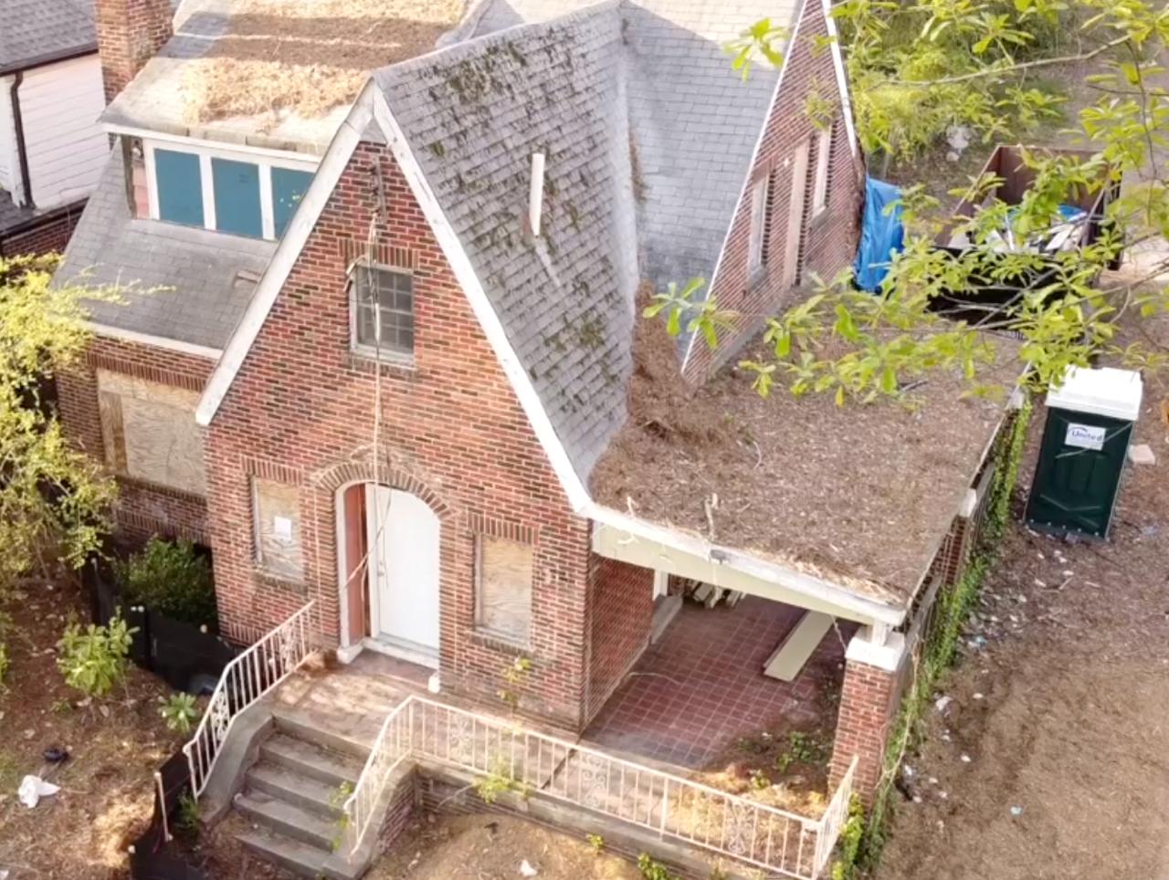 Oblique property view showing roof surfaces